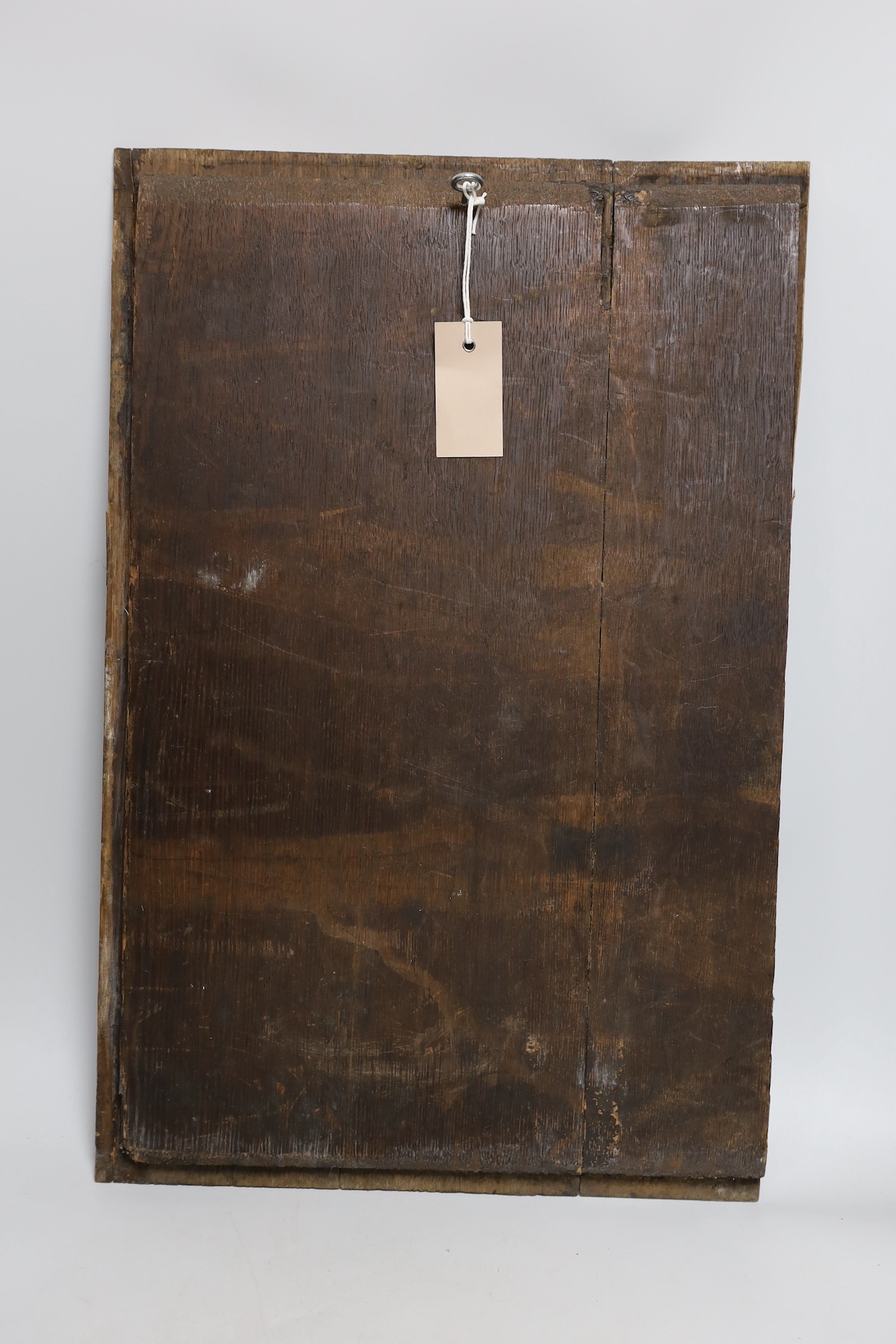 A 17th century style carved oak panel, 'Colonist attacking a Native American Indian' 56x36cm